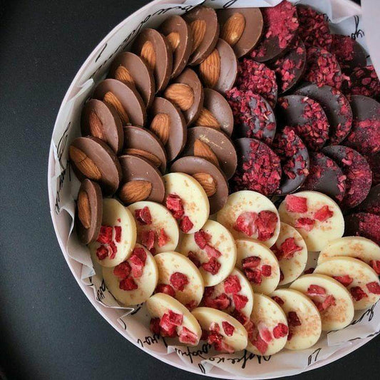 Dark, milk and white chocolate mediants with dried fruits and almond