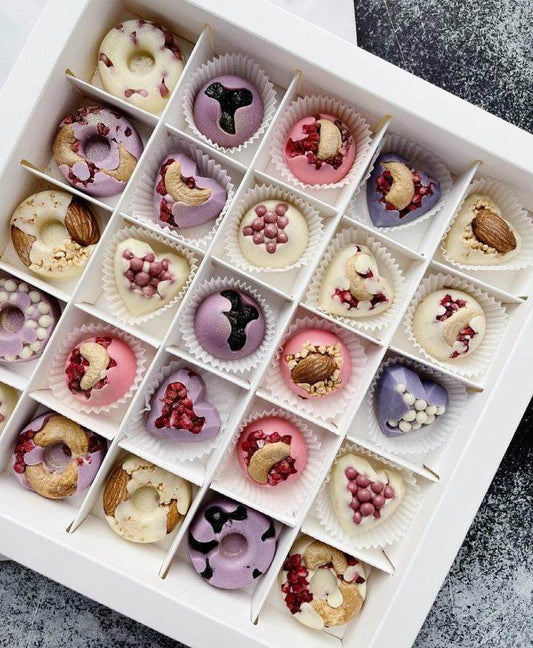 White chocolate bonbons with nuts and dried fruits