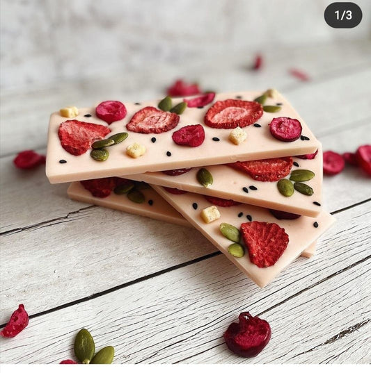 White chocolate bar with dried strawberries and pumpkin seeds